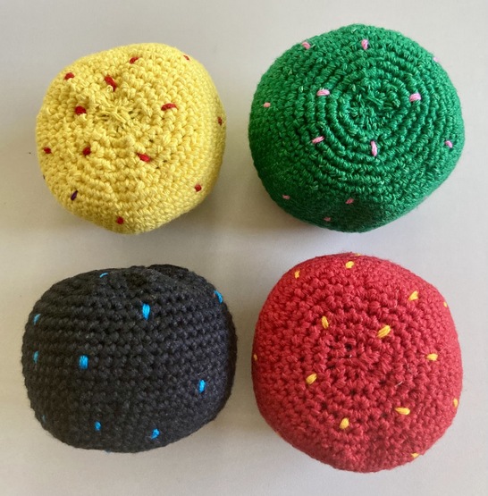 Handcrafted cotton footbag with an eye-catching colorful polka dot pattern hand-crocheted in Guatemala.