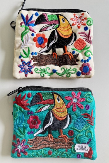 Artisan zippered suede coin purse intricately embroidered with a vibrant tropical Toucan bird design.
