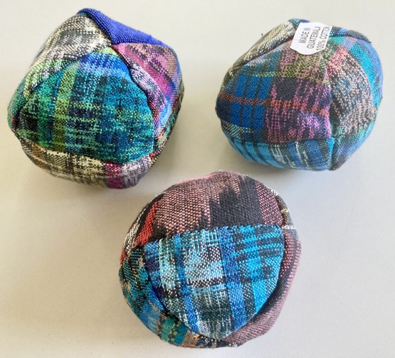 Guatemalan artisan footbag showcasing traditional multicolored block panels woven from thick cotton.