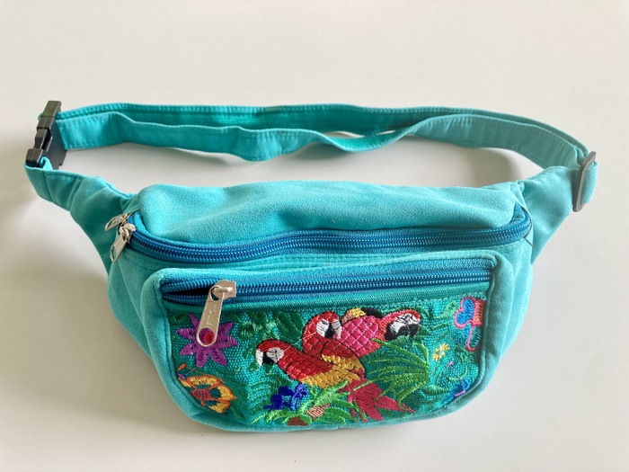 Handcrafted fanny pack waist bag combining genuine leather trims and colorful hand-woven Mayan geometric parrot fabrics.